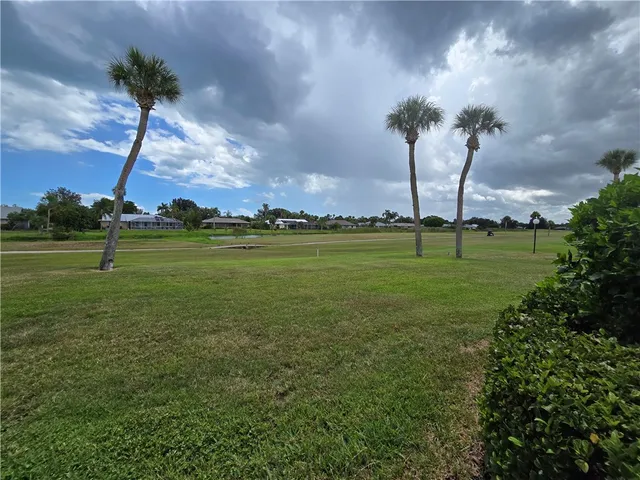 a view of a golf course with a big yard
