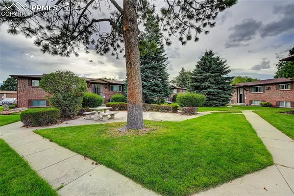a view of a house with a yard