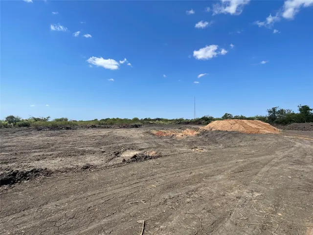 a view of an ocean beach and mountain