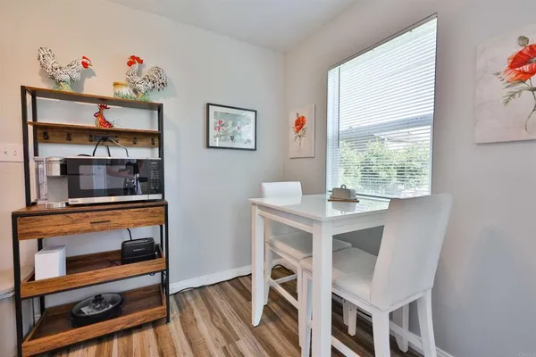 a kitchen with cabinets and window