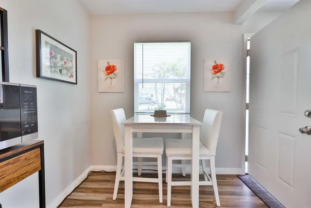 a view of a kitchen with stove and refrigerator