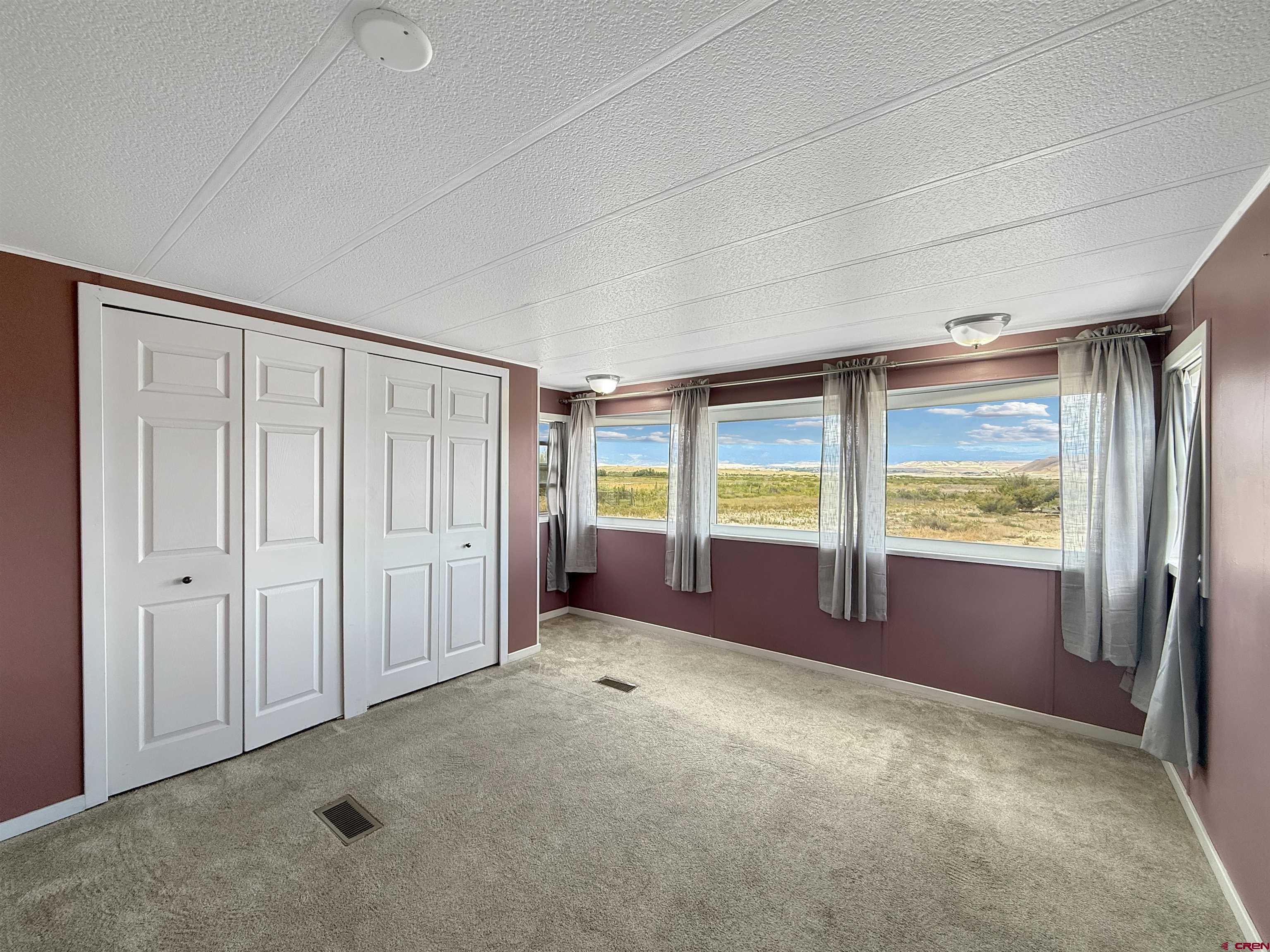 5057 Peach Valley Road Delta, CO 81416 - Photo 13 of 22 an empty room with entrance door