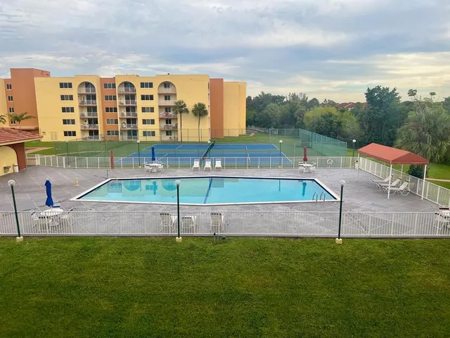 a view of an empty room and a window