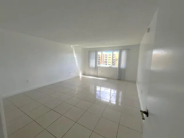 a bathroom with a shower and a glass door