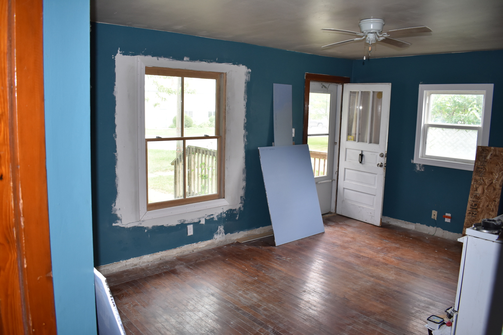 110 West Oak Street Paxton, IL 60957 - Photo 3 of 9 a view of an empty room with window and wooden floor