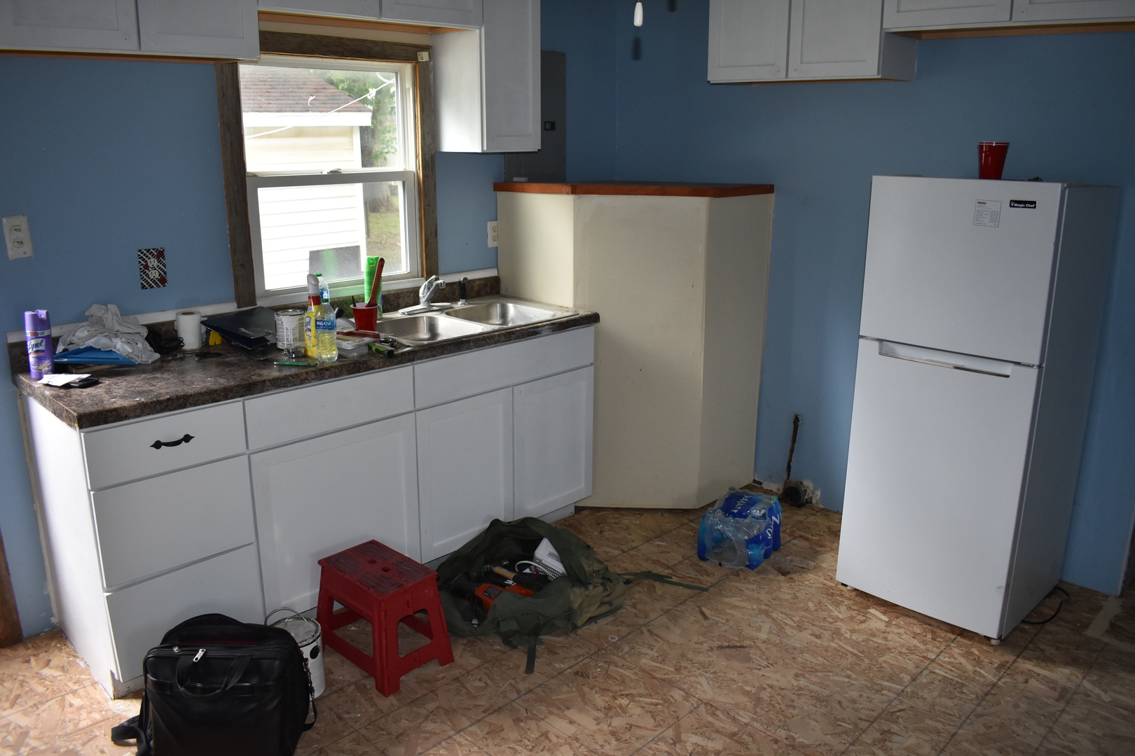 110 West Oak Street Paxton, IL 60957 - Photo 4 of 9 a room with a refrigerator and a dresser