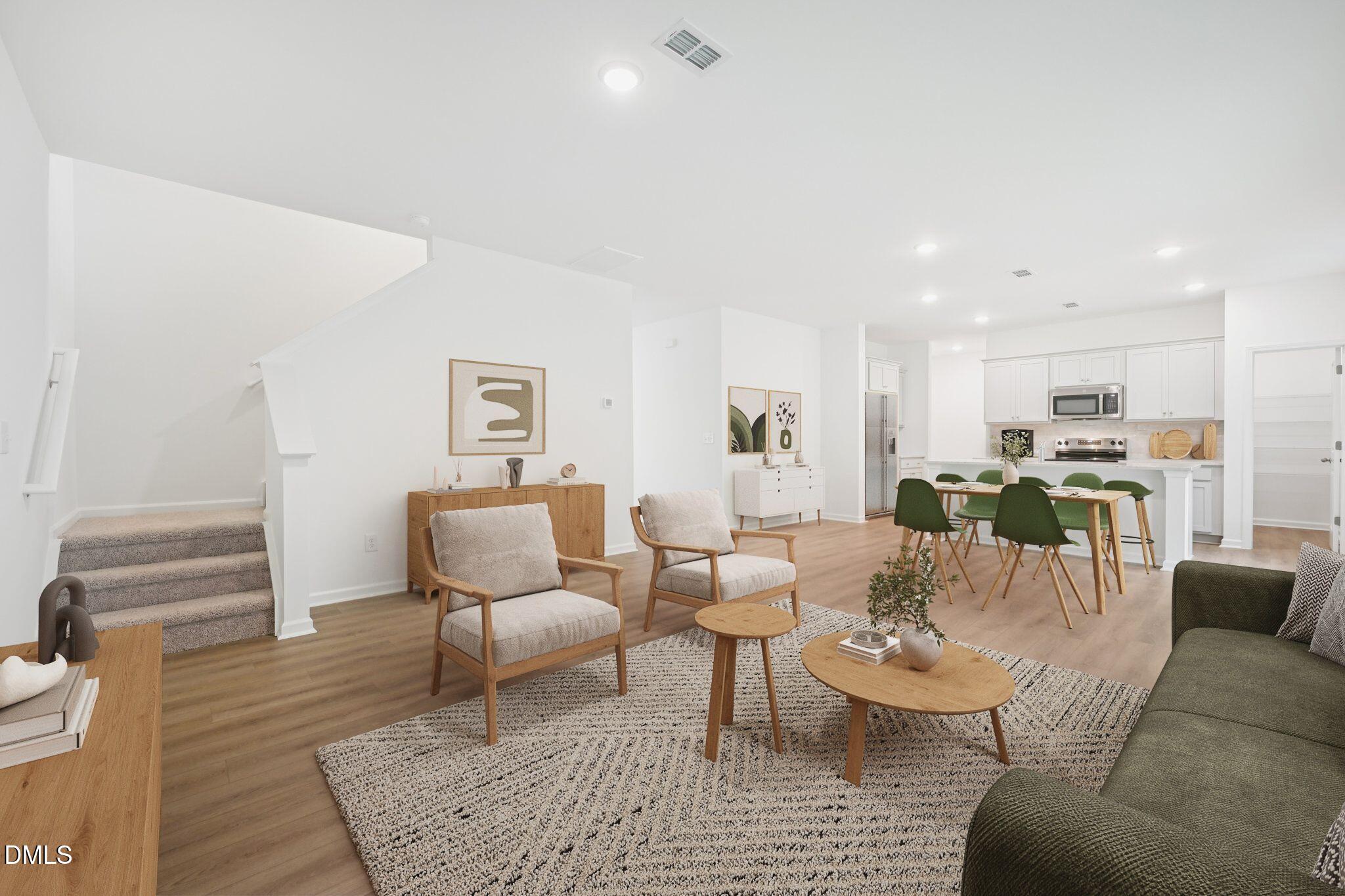 11335 Salers Loop Middlesex, NC 27557 - Photo 13 of 18 a living room with furniture kitchen view and a wooden floor