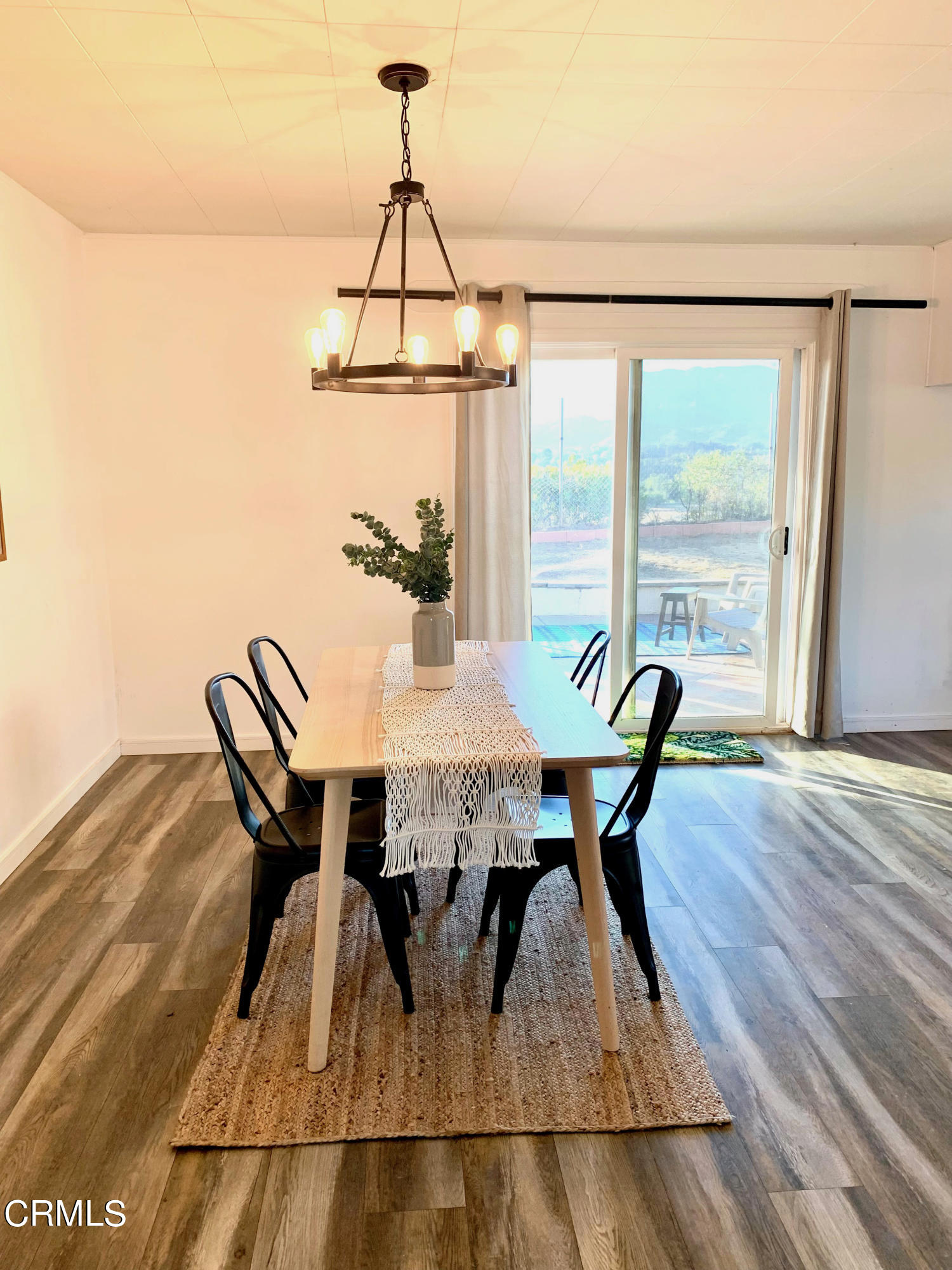 175 Rio Via Oak View, CA 93022 - Photo 14 of 19 a view of a dining room with furniture window and wooden floor
