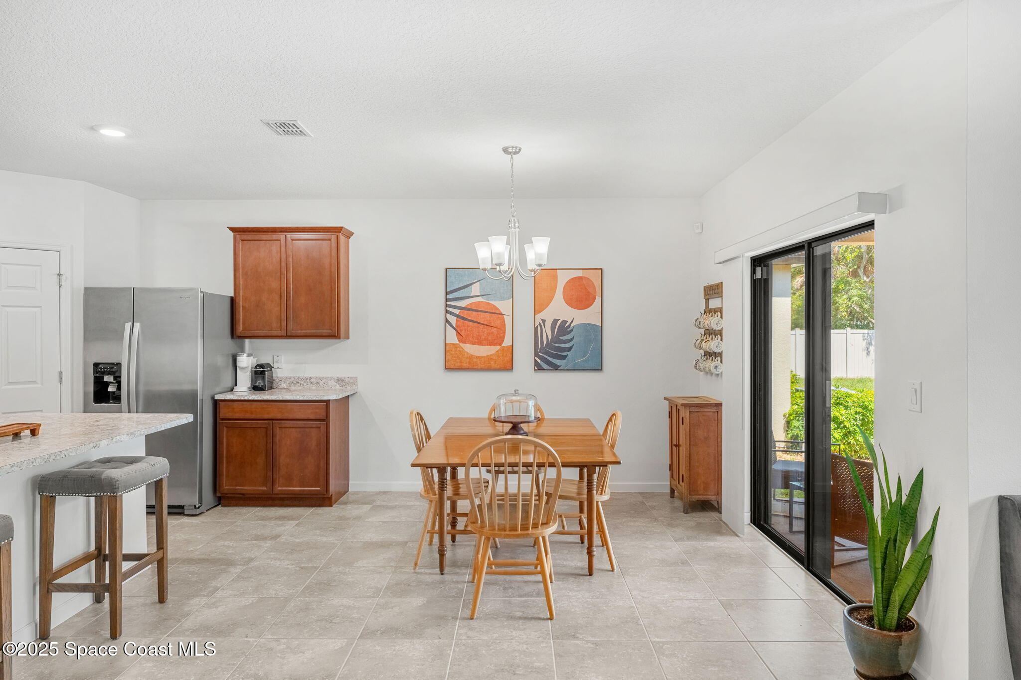 369 Coyote Drive Cocoa, FL 32927 - Photo 11 of 32 Dining area with a view of the backyard