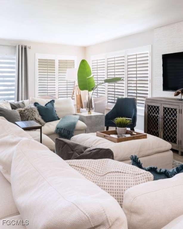 12 Knights Bridge Road, Unit A32 Naples, FL 34112 - Photo 6 of 7 a bedroom with two beds and a television