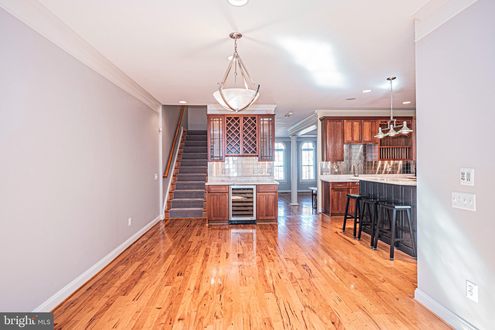 5448 Edsall Ridge Place Alexandria, VA 22312 - Photo 16 of 52 a view of a room with wooden floor fireplace and windows