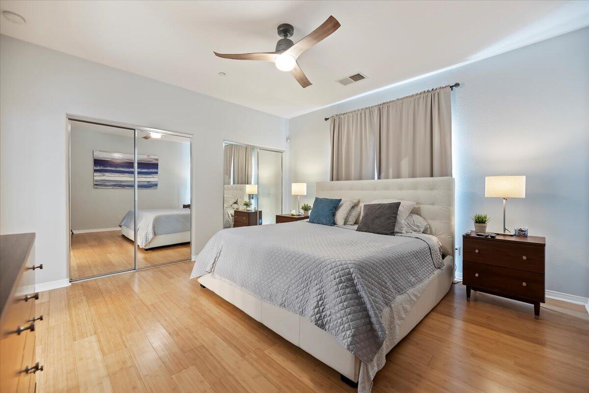 3982 Eastgate N Road Palm Springs, CA 92262 - Photo 23 of 55 a bedroom with a bed and a chandelier