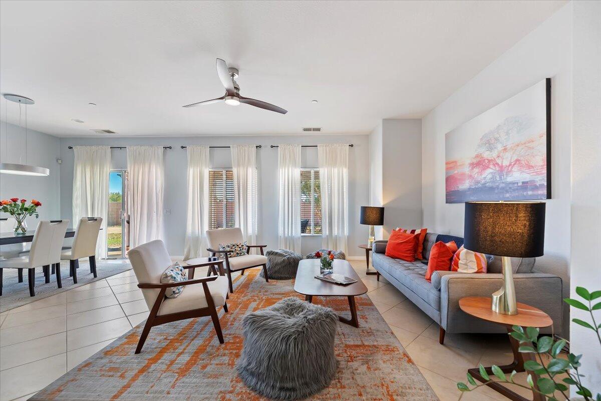 3982 Eastgate N Road Palm Springs, CA 92262 - Photo 3 of 55 a living room with furniture and a flat screen tv