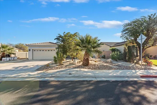 a front view of a house with a garage