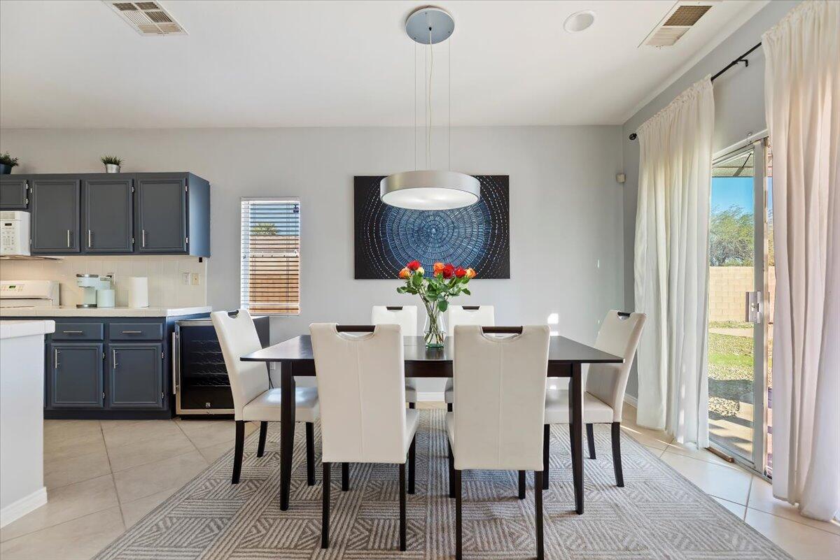3982 Eastgate N Road Palm Springs, CA 92262 - Photo 8 of 55 a dining room with furniture a window and kitchen view