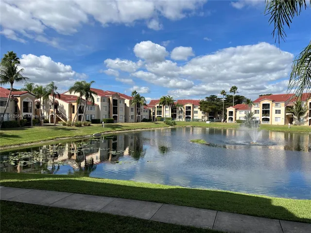 a view of a lake with a building in the background