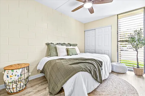 a bedroom with a bed and a couch