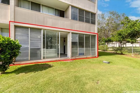 a view of a house with backyard and porch