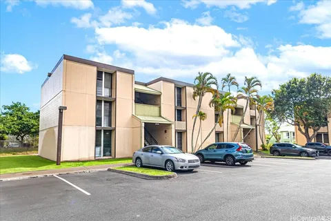 a view of a street with cars