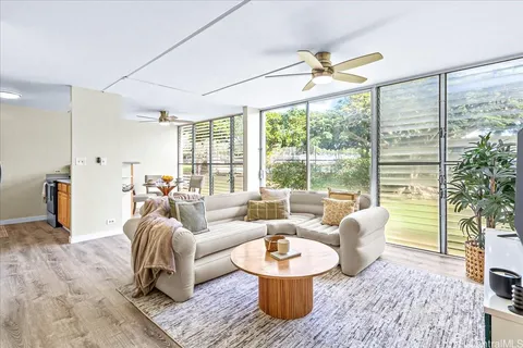 a living room with furniture and a large window