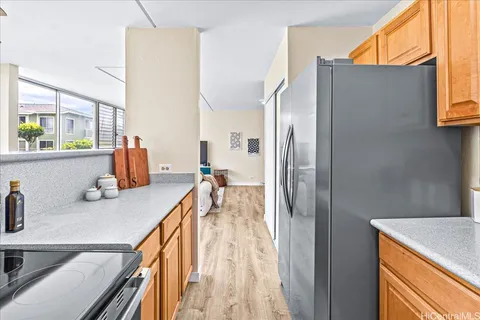 a en suite bathroom with a granite countertop sink and a mirror
