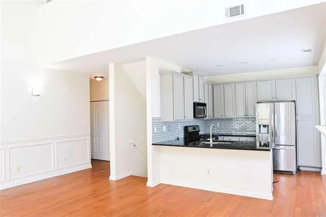 an empty room with wooden floor