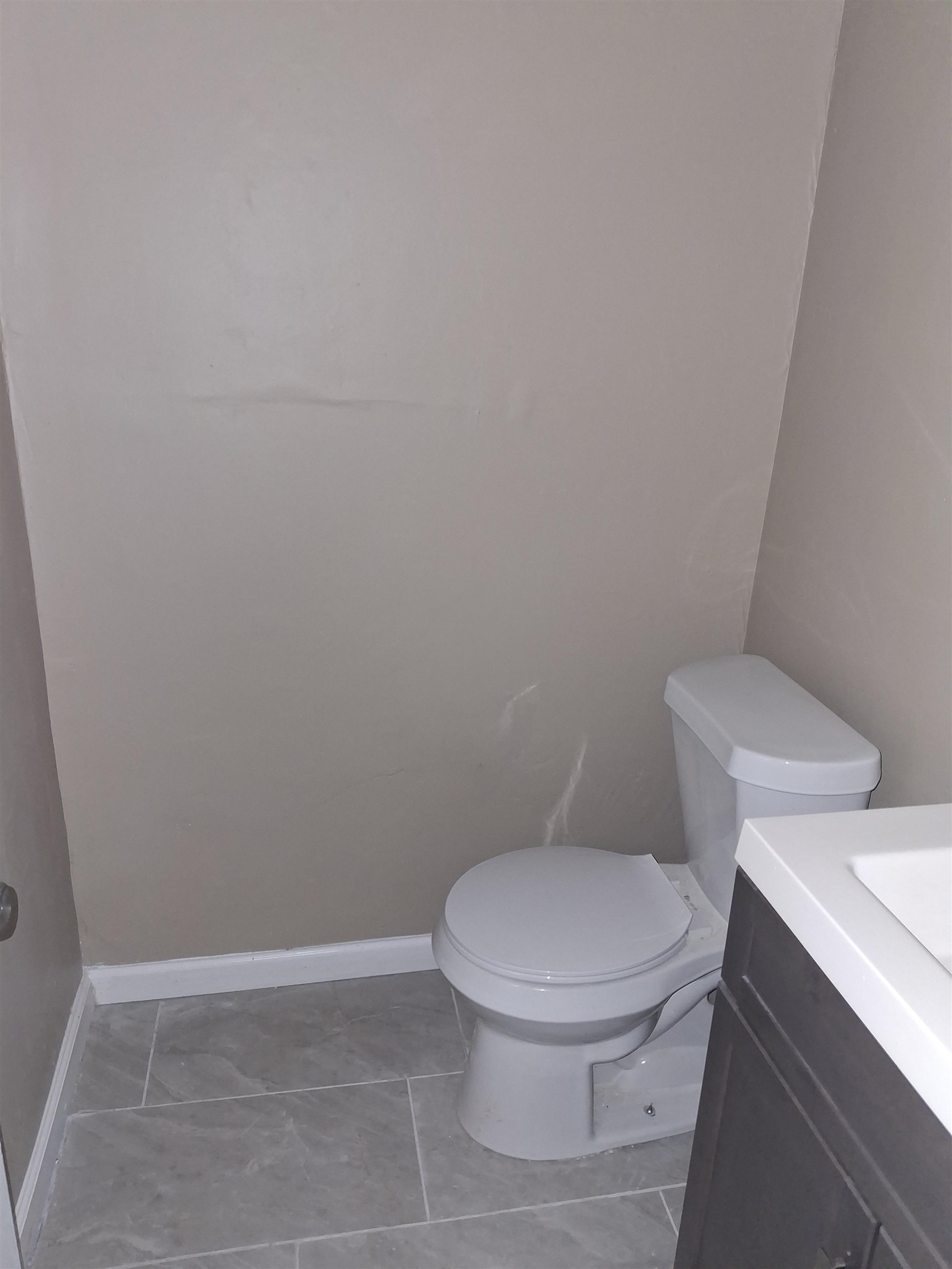 3554 Morning Dew Court, Unit 11 Memphis, TN 38118 - Photo 13 of 25 a white toilet sitting next to a white wall