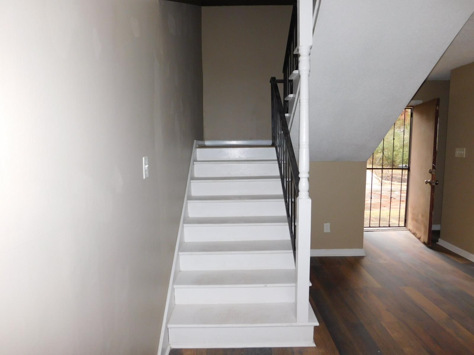 3554 Morning Dew Court, Unit 11 Memphis, TN 38118 - Photo 15 of 25 a view of staircase with wooden floor and windows