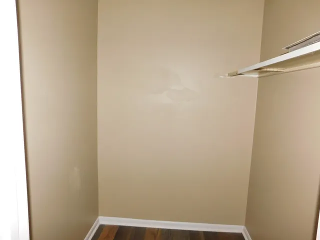 a bathroom with a sink mirror and toilet