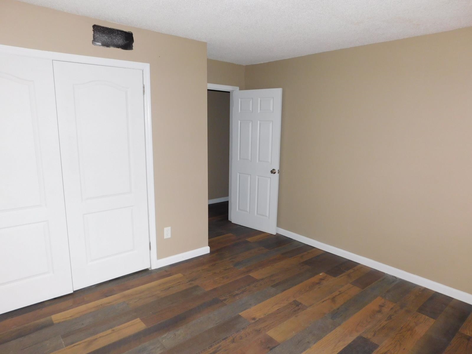3554 Morning Dew Court, Unit 11 Memphis, TN 38118 - Photo 23 of 25 an empty room with wooden floor