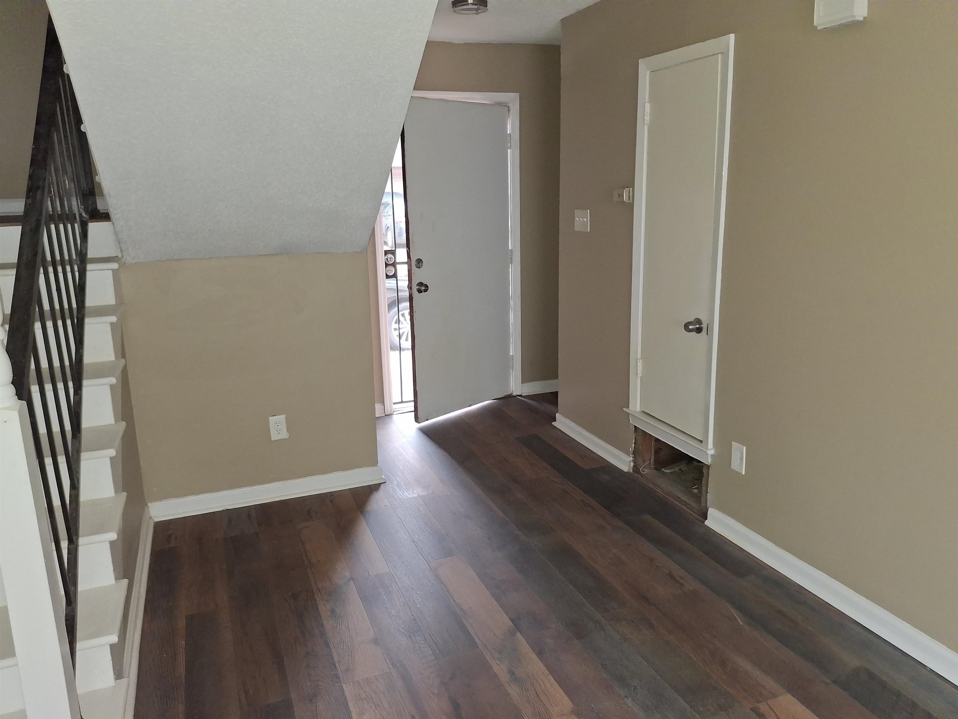 3554 Morning Dew Court, Unit 11 Memphis, TN 38118 - Photo 3 of 25 an empty room with wooden floor and windows