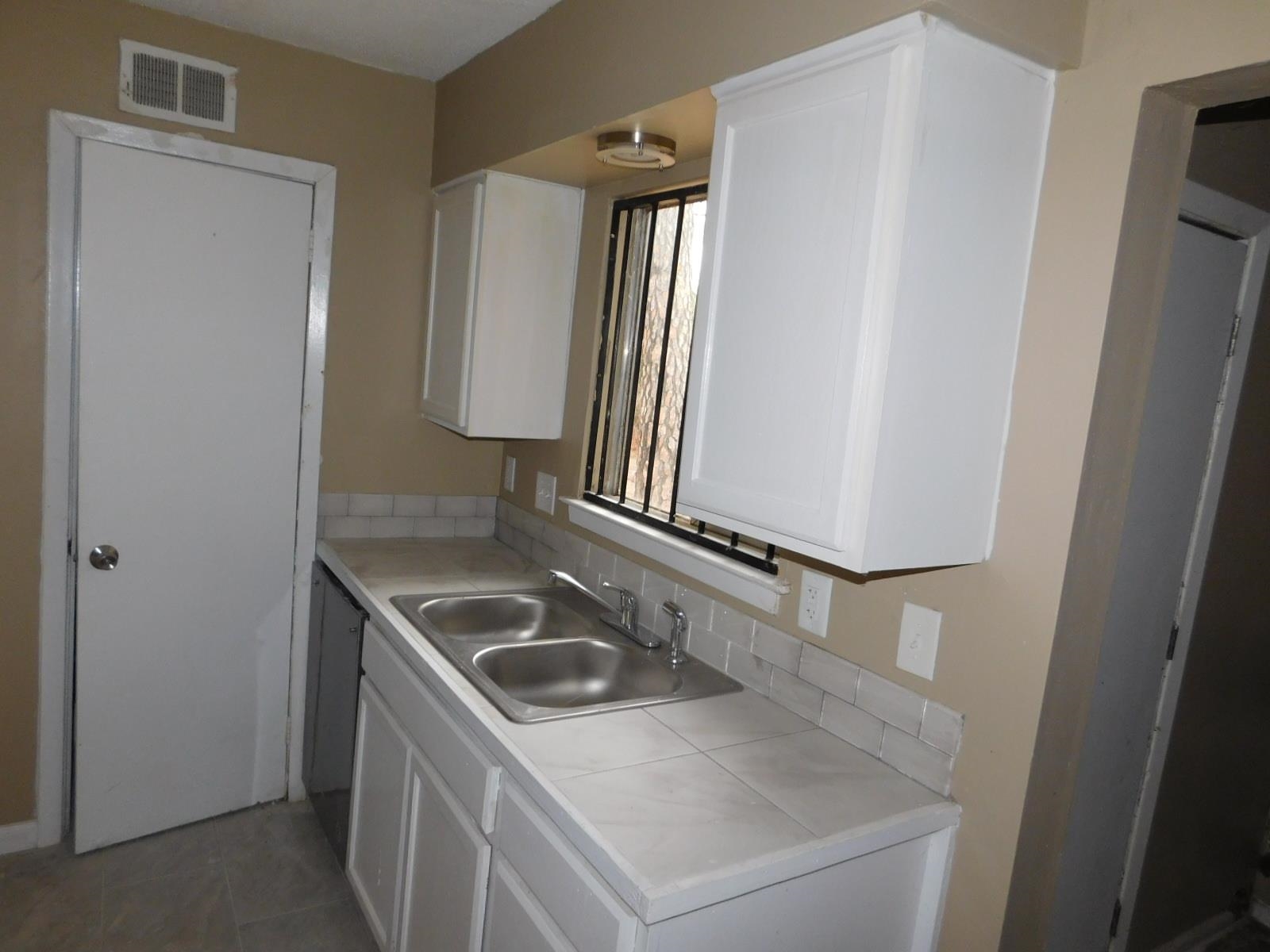 3554 Morning Dew Court, Unit 11 Memphis, TN 38118 - Photo 10 of 25 a bathroom with a sink and a mirror