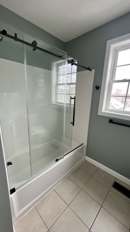 15 Gale Street, Unit 1 Lawrence, MA 01841 - Photo 14 of 25 a bathroom with a bathtub and a shower