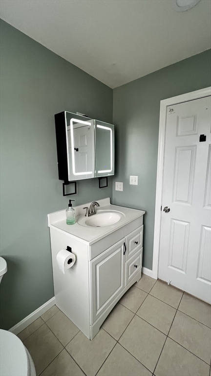15 Gale Street, Unit 1 Lawrence, MA 01841 - Photo 15 of 25 a bathroom with a toilet sink and mirror