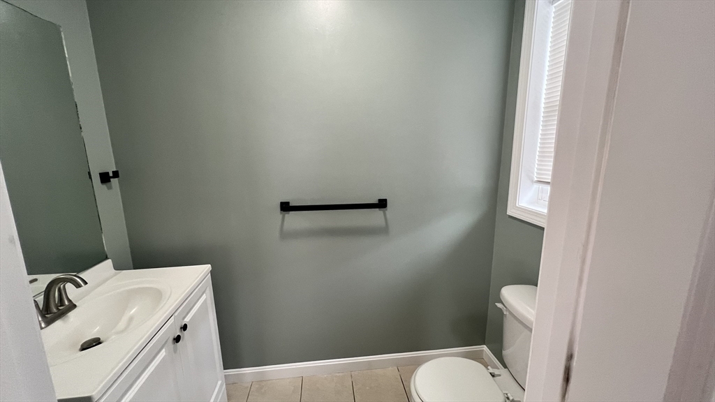 15 Gale Street, Unit 1 Lawrence, MA 01841 - Photo 7 of 25 a bathroom with a sink and a toilet