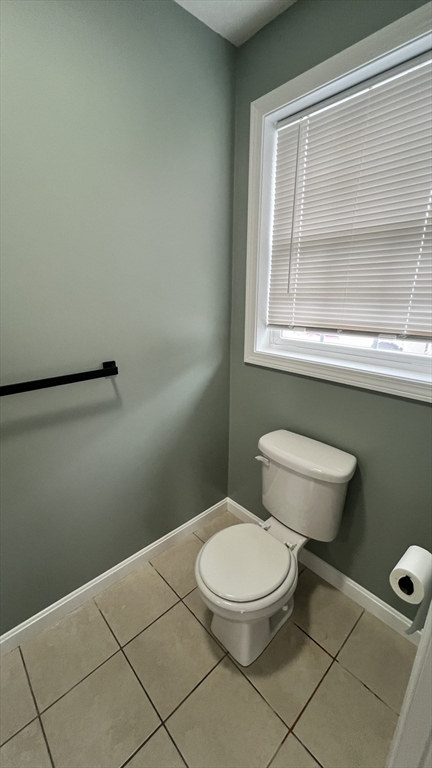 15 Gale Street, Unit 1 Lawrence, MA 01841 - Photo 9 of 25 a white toilet sitting next to a bathroom sink