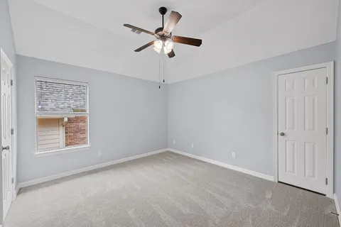 a view of room with ceiling fan