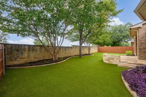 a view of a house with backyard porch and sitting area