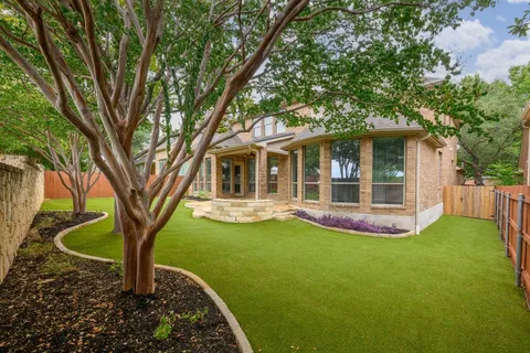 a front view of a house with a yard and porch