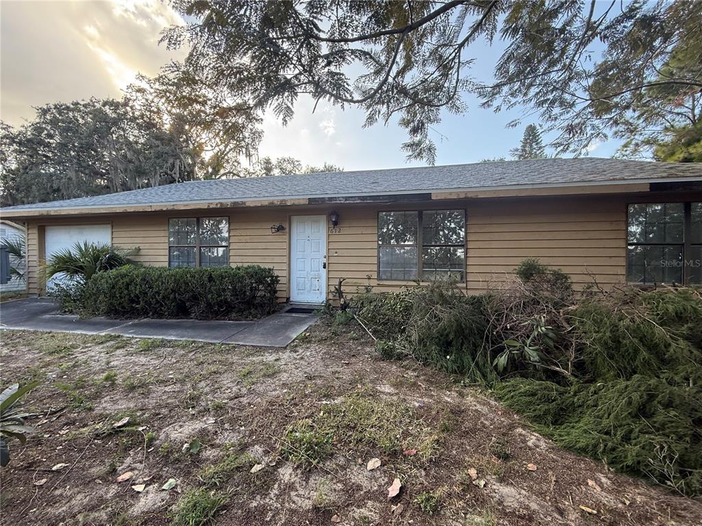 612 North 8th Street Dundee, FL 33838 - Photo 1 of 1 a front view of a house with garden