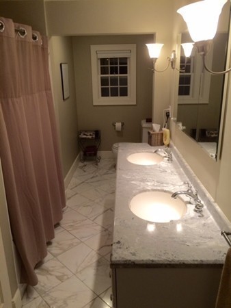 5 Leicester Road Marblehead, MA 01945 - Photo 15 of 30 a view of a bathroom with tub and mirror