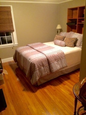 5 Leicester Road Marblehead, MA 01945 - Photo 17 of 30 a bedroom with a bed and wall painting