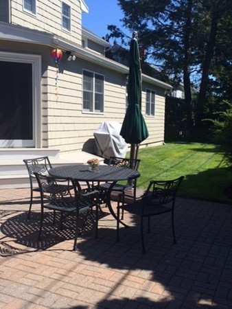 5 Leicester Road Marblehead, MA 01945 - Photo 24 of 30 a view of a dinning table and chairs in patio of the house