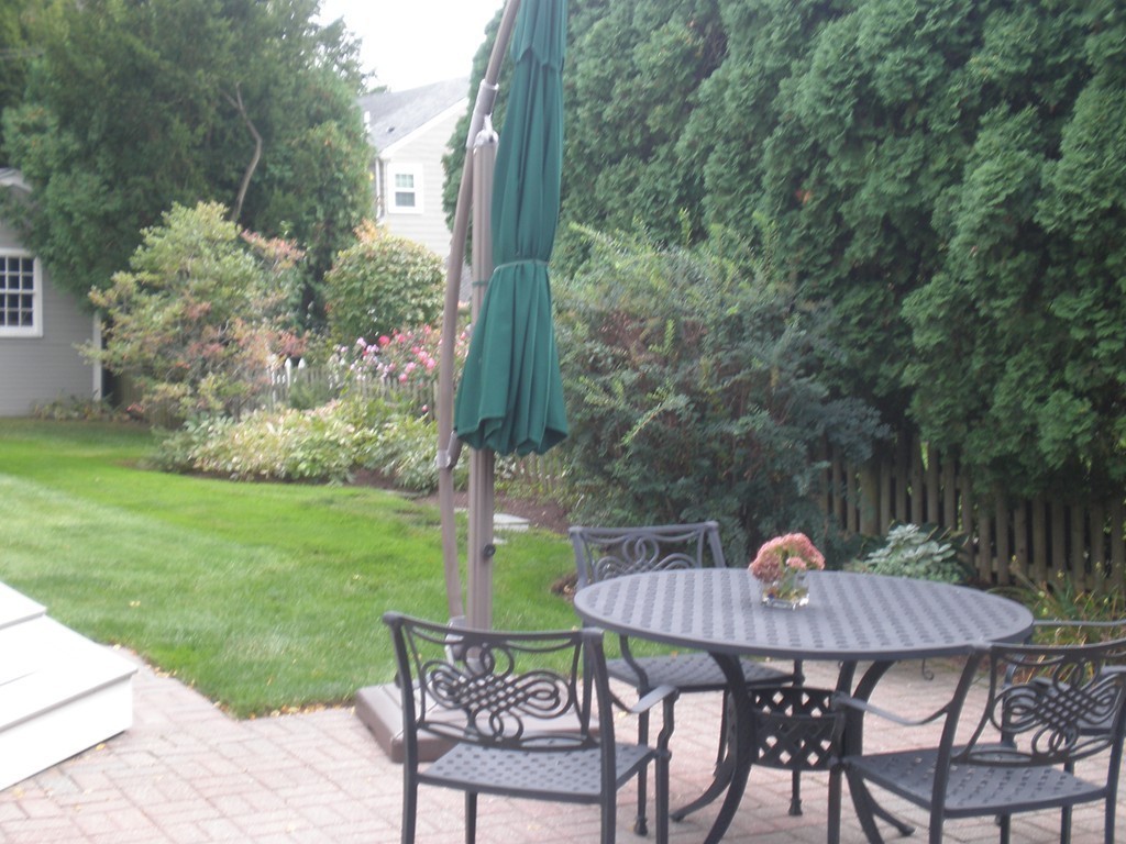 5 Leicester Road Marblehead, MA 01945 - Photo 26 of 30 a view of a table and chairs in the garden