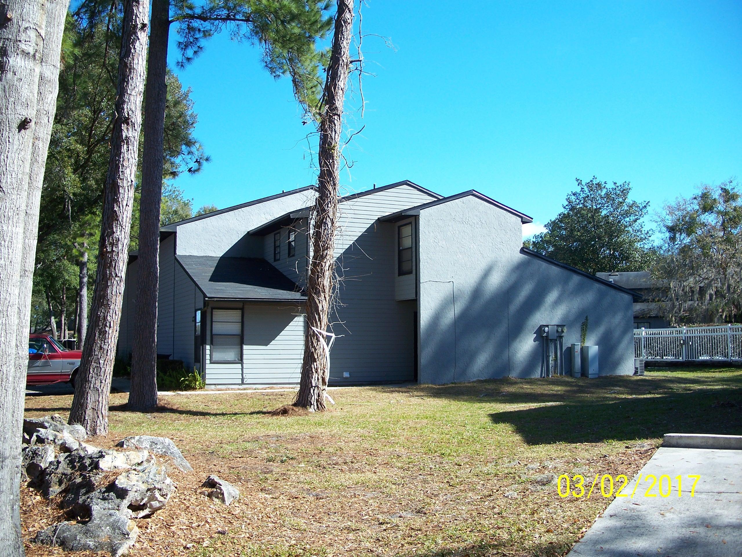 4429 Southwest 20th Lane Gainesville, FL 32607 - Photo 3 of 12 a house view with a garden space