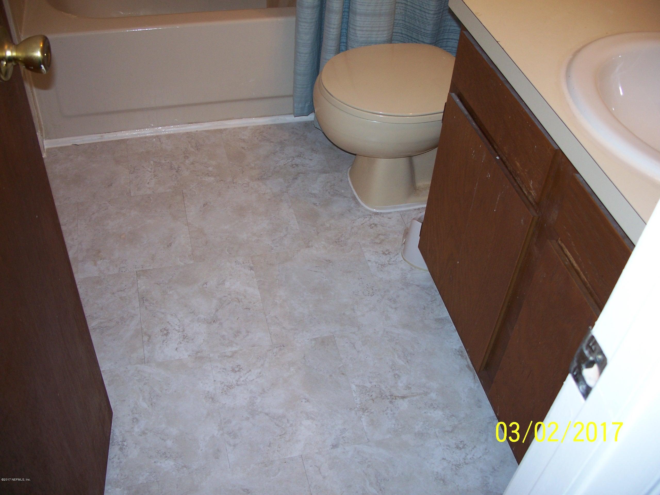 4429 Southwest 20th Lane Gainesville, FL 32607 - Photo 4 of 12 a view of a storage and utility room with a sink
