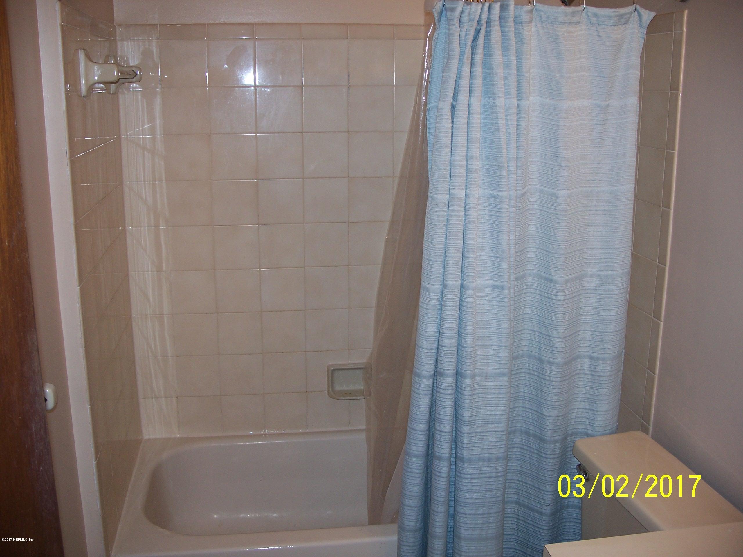 4429 Southwest 20th Lane Gainesville, FL 32607 - Photo 5 of 12 a bathroom with a shower