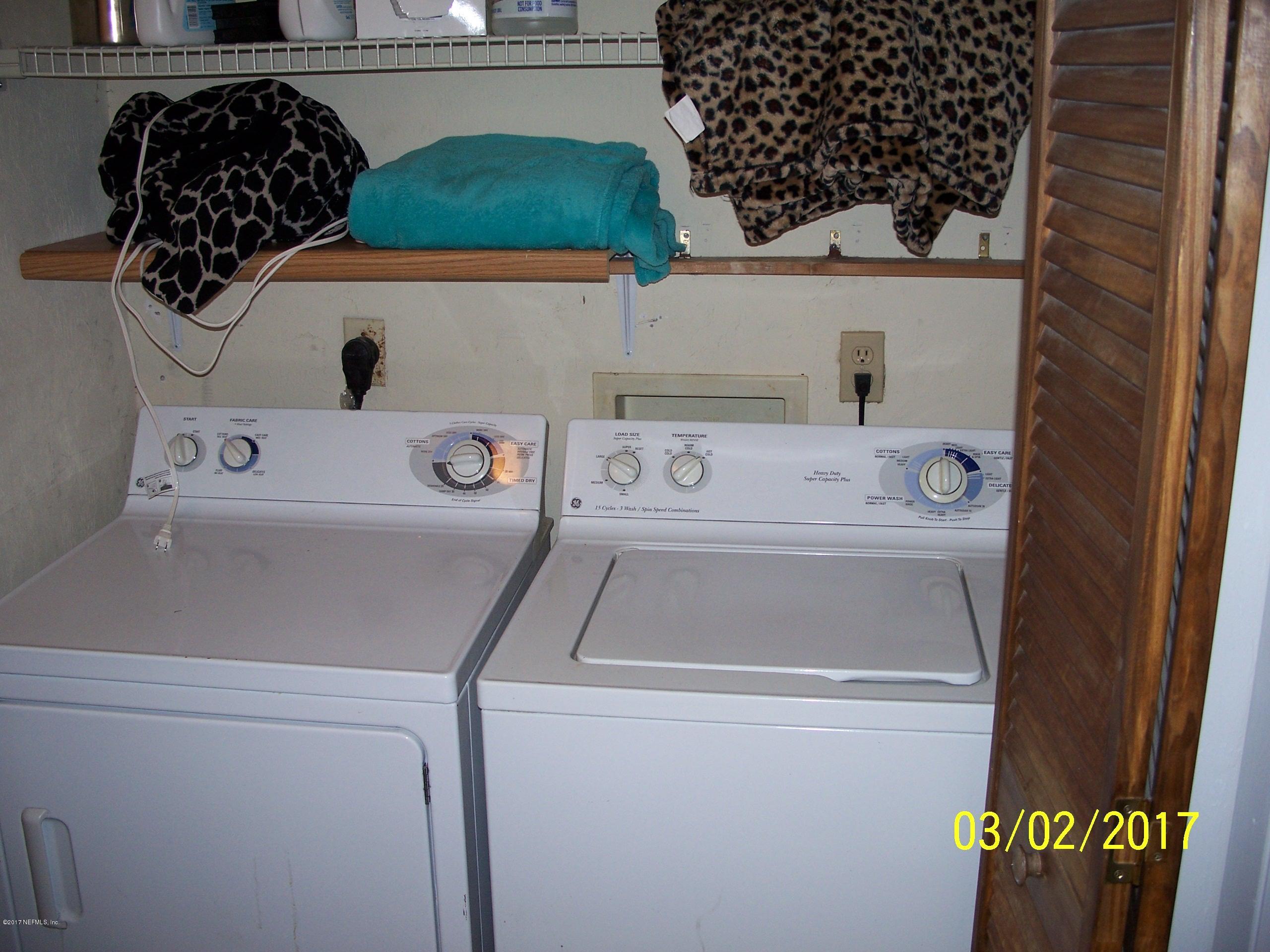 4429 Southwest 20th Lane Gainesville, FL 32607 - Photo 10 of 12 a utility room with dryer and washer
