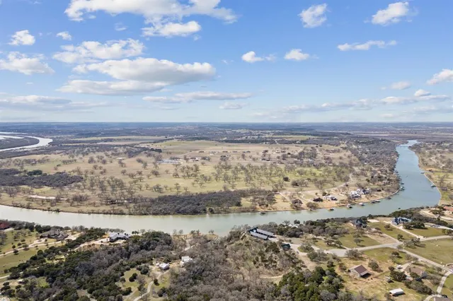 an aerial view of a residential houses with outdoor space