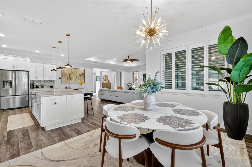 8433 Southwest 98th Terrace Road Ocala, FL 34481 - Photo 14 of 30 a kitchen with a table and chairs in it